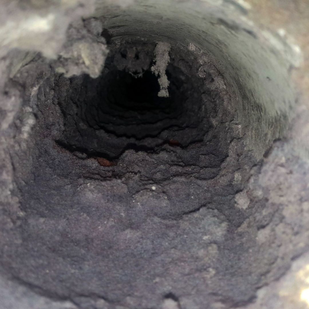 An in-depth cleaning process showcasing Air N Fire's dryer vent cleaning service expertise.