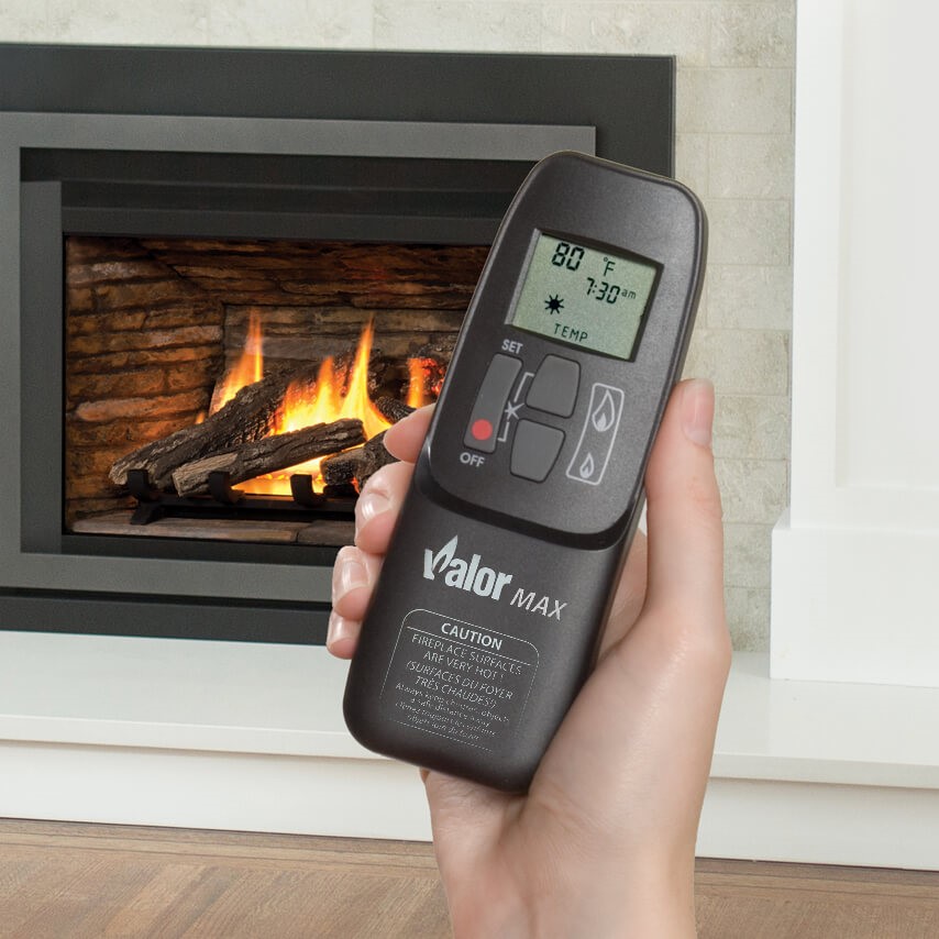 Person holding Valor-Max remote control